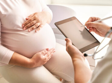 Pregnant woman visit doctor center. Gynecology maternity treatment Pregnant woman visit doctor center. Gynecology maternity treatment. Modern medical hospital. Health care check. Female patient. Unrecognizable person. Pandemic concept